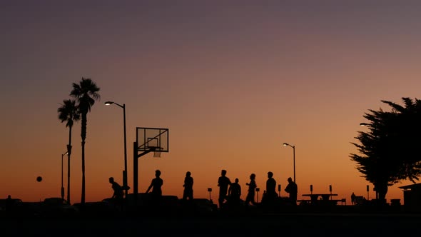 Players on Basketball Court Playing Basket Ball Game Sunset Beach California