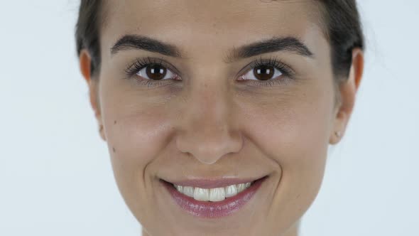 Winking Eye, Girl Face, White Background in Studio alt