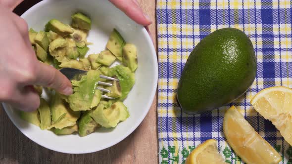 Cooking Guacamole From Raw Avocado, Stop Motion Timelapse, View From Above. Vegetarian Snack Recipe