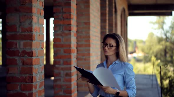 Civil Engineer Checking Construction Site. Woman Architect  Inspecting Real Estate Building. alt