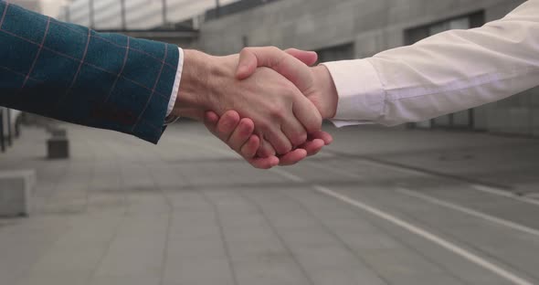 Two Men Shake Hands Conclude Successful Contract Agreement Sign of Support for Partnership alt