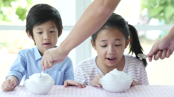 Happy Little Asian Children  Eating Shaved Ice At Home Slow Motion alt
