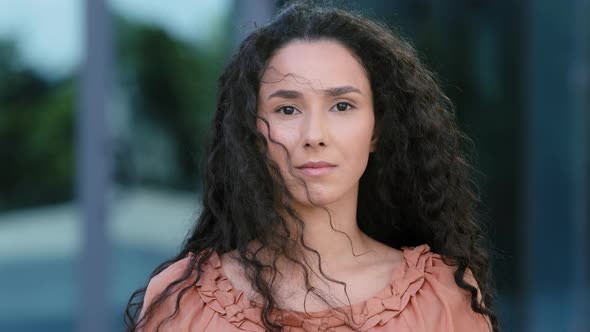 Female Outdoors Portrait Young Beautiful Serious Calm Millennial Hispanic Girl Curly Brunette Woman alt