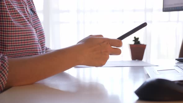 Push in, close up of unrecognizable hands using smartphone.