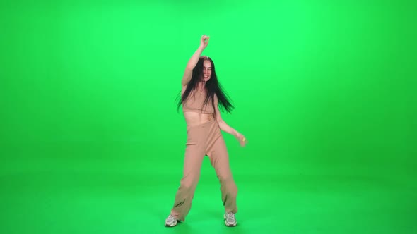 Caucasian Cheerful Female Dancing Vigorously at a Music Concert Dance and Swing Their Arms on a alt