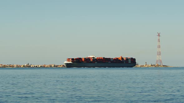 Industrial Container Naval Ship is Passing on the Strict of Messina in the Sea alt