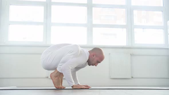 Sporty Yogi Man Working Out Doing Handstand Yoga Asana