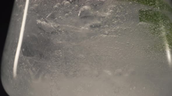 Ice Bubbled Mint Drink Wineglass Slow Motion Closeup alt