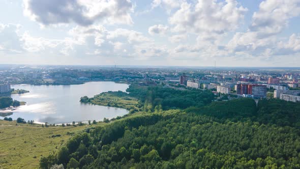 Aerial hyperlapse bird's eye view of river in the middle of the forest. Drone footage