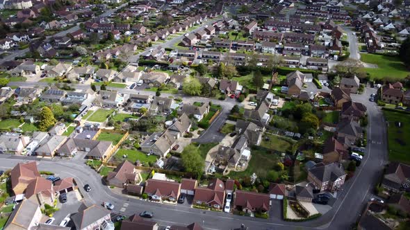 Top down aerial birds eye view of suburban town in Wiltshire, England alt