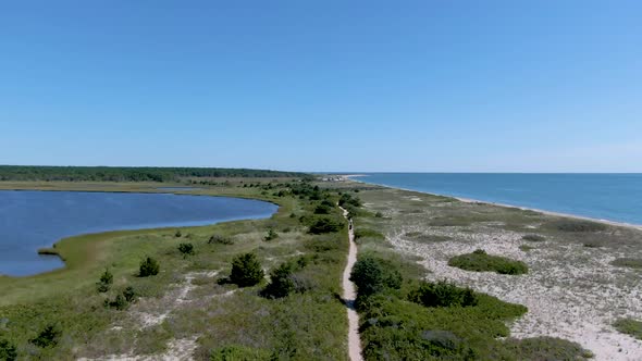 Aerial view of waterlands , ocean and walking path through national research reserve alt