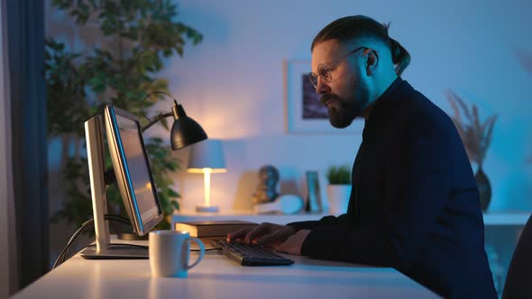 Man Working Late on Computer