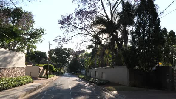 Wide shot of a suburban street in Johannesburg, South Africa alt