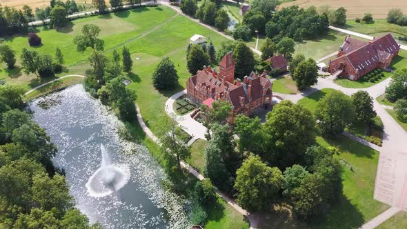 Jaunmoku Brick Medieval Castle Near Tukums, Latvia  Aerial Dron 4k Shot Jaunmokas Manor Park. alt