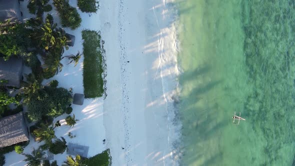 Vertical Video Boats in the Ocean Near the Coast of Zanzibar Tanzania Aerial View alt