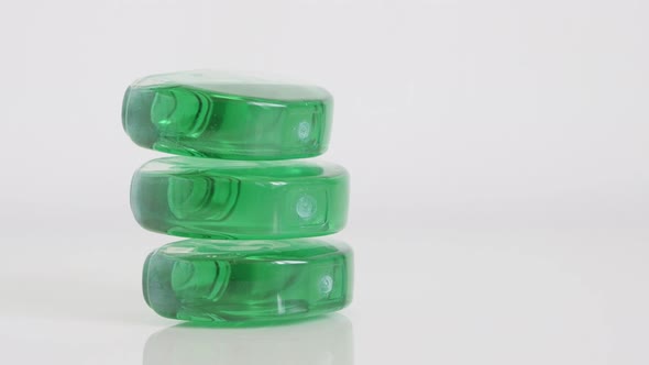 Pile of gel bowl fresheners on white background 4K footage alt