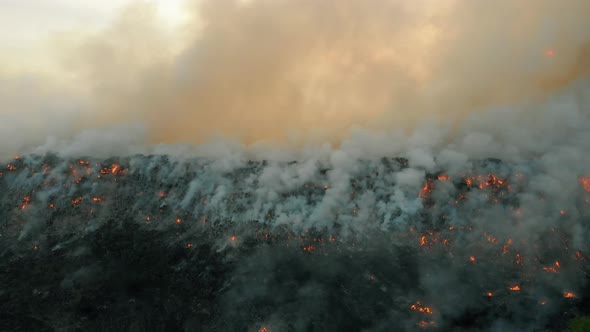 Aerial View at Fire at Garbage Dump, Burning Pollutes the Environment. Ecological Catastrophe  alt