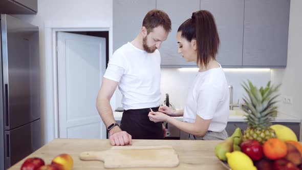 Couple Cooking Together At Home In The Kitchen alt