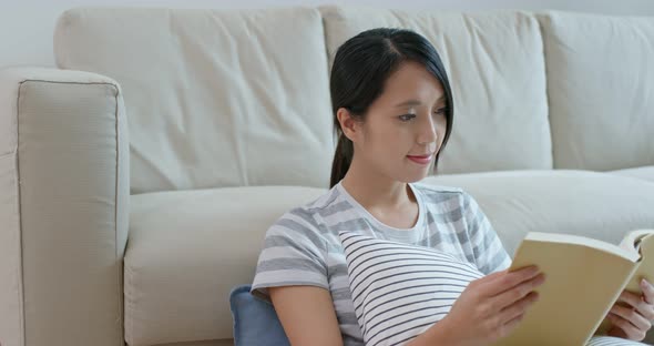Woman read book at home alt
