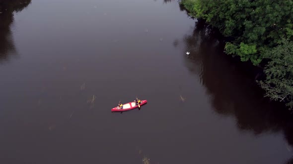 The Pink Canoe in the Middle of the River in Estonia alt