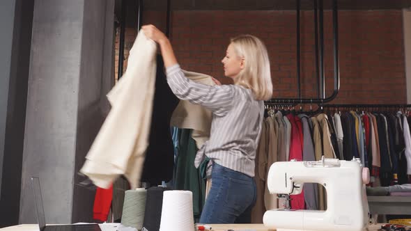 Young Creative Tailor Making Up a Fashion Stylish Clothes alt