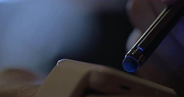 Smart Watch and Stylus at Night alt