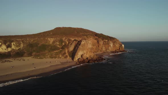 An Aerial Shot of the Point Dume Cliffs in Malibu in California in the Evening as the Vibrant Sun Se alt