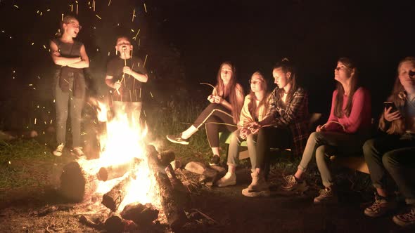 Teens Looking at Bright Campfire., Stock Footage | VideoHive