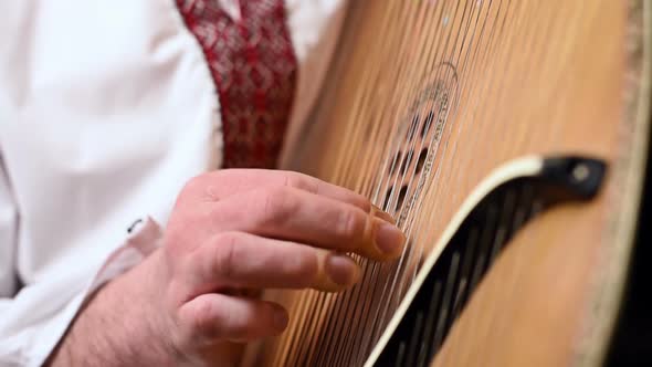 Man Playing On Bandura alt