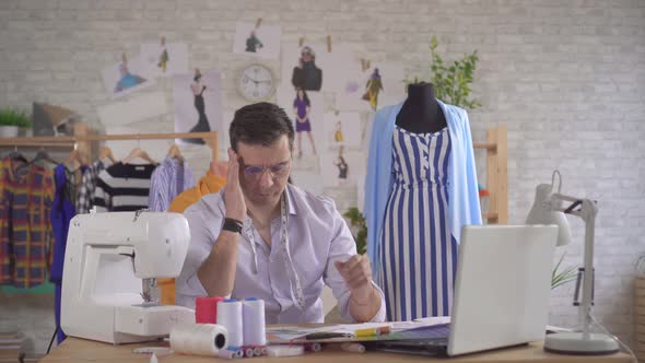 Man Fashion Designer Has Difficulty with Ideas No Inspiration alt