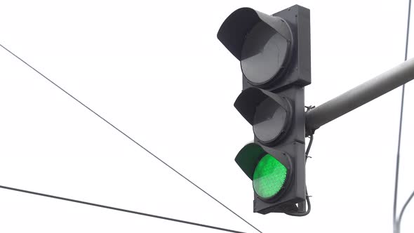 Traffic Light on the Road Regulates Traffic alt