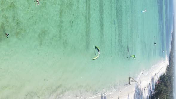 Zanzibar Tanzania  Vertical Video Kitesurfing Near the Shore of Ocean Slow Motion alt