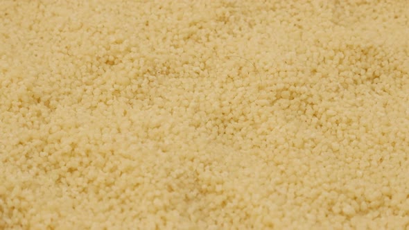 Raw Couscous balls pile popular African food background 4K 3840X2160 UHD video - Instant  steamed ba alt