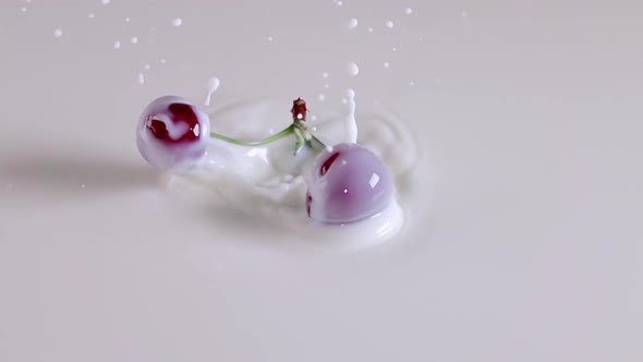 Two Cherries Falls Into Milk
