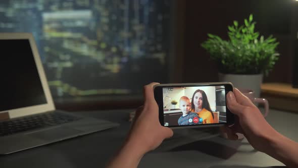 Female Hands Holding Smartphone with Video Calling