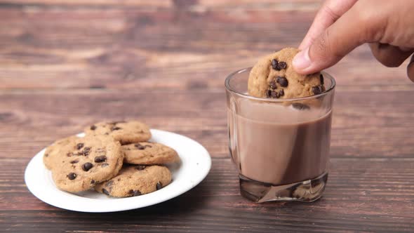 Pouring Chocolate Cooking in Glass of Chocolate Milkshake alt