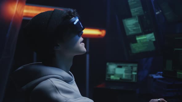 Young Hacker in Virtual Reality Glasses alt