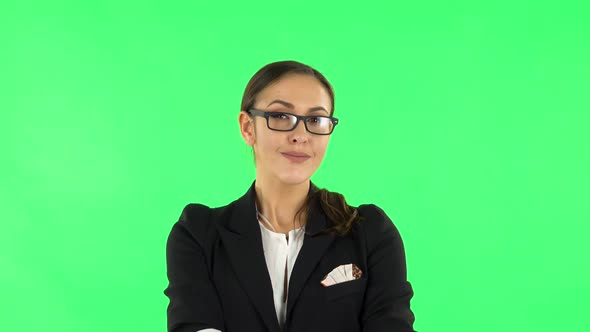 Woman Smiling While Looking at Camera, Green Screen alt