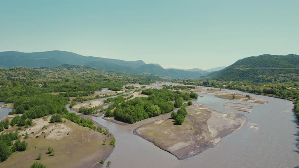 Scenic Drone Shot of a Huge River and Its Cascades alt