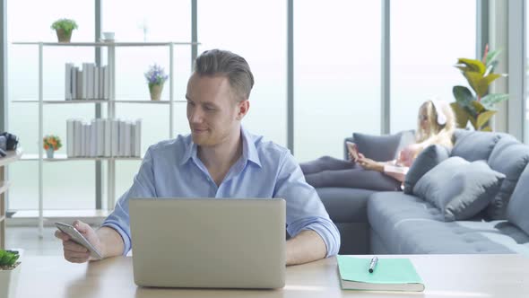 Smiling business blonde, white man person working from home on table with computer alt