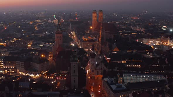 Approaching City Center of Munich Big City in Germany at Night From Aerial Drone Perspective, City alt