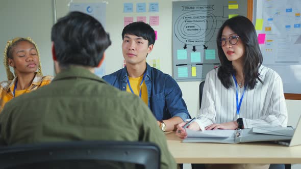 female Woman during job interview and three startup founders members alt