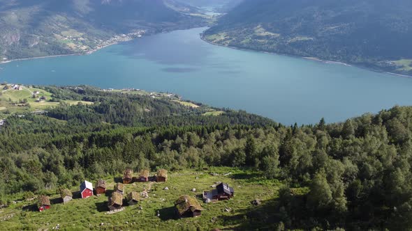Raksetra between Stryn and Loen Norway - Sunny day aerial with mountain cabins and fjord view alt