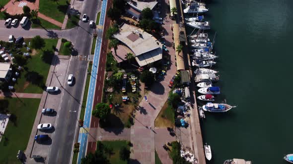 Aerial Top Drone View of Coastline with Embankment and Dock for Yachts and Ships alt