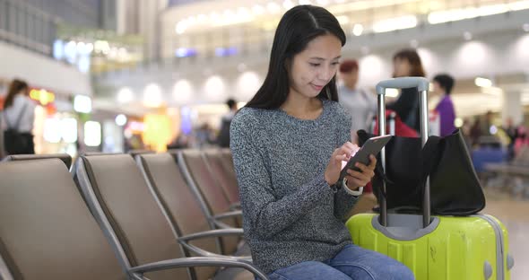 Woman Use of Mobile Phone in Airport 