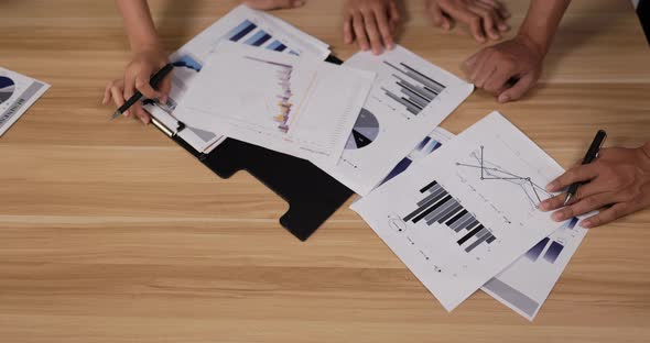 Businesspeople pointing and explaining the information alt