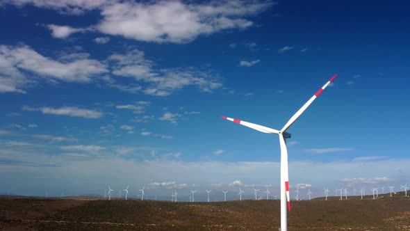 Drone Flies Over a Windmill Park alt