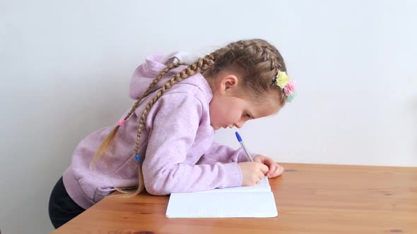 Child Doing Homework at the Table