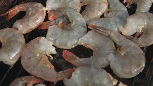 Top View Panorama of the Large Raw Shrimps Roasting on the Grill Grid alt