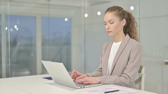 Attractive Businesswoman Pointing at the Camera in Modern Office  alt